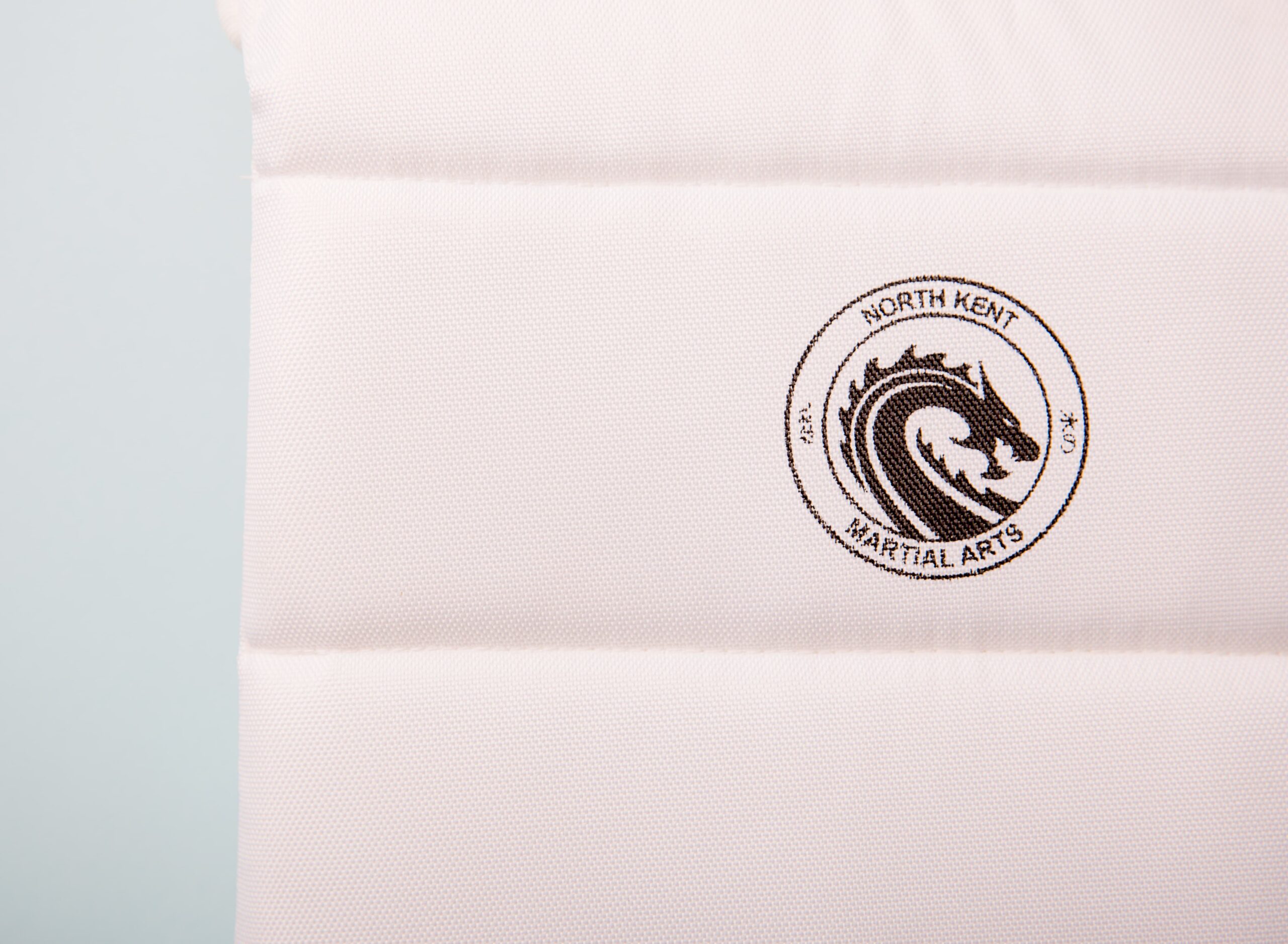 NKMA Body Protector - close up front product with logo