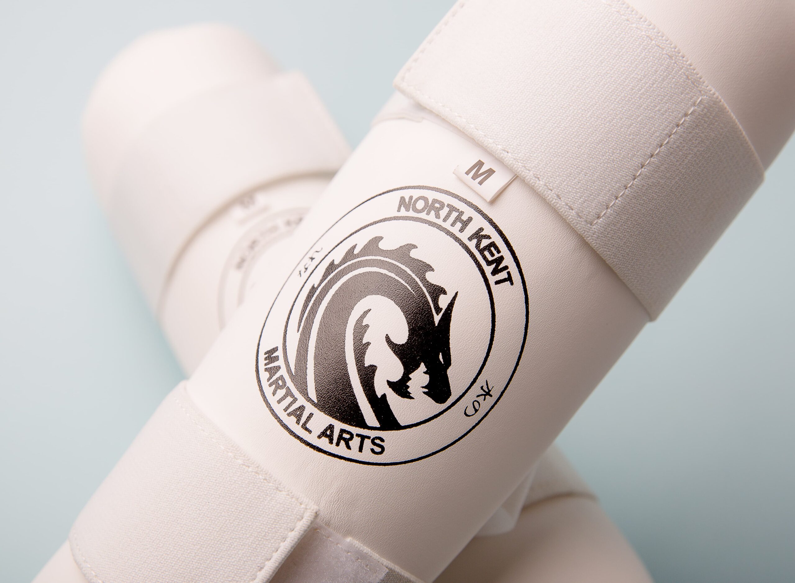 NKMA Leg Protectors - logo close up