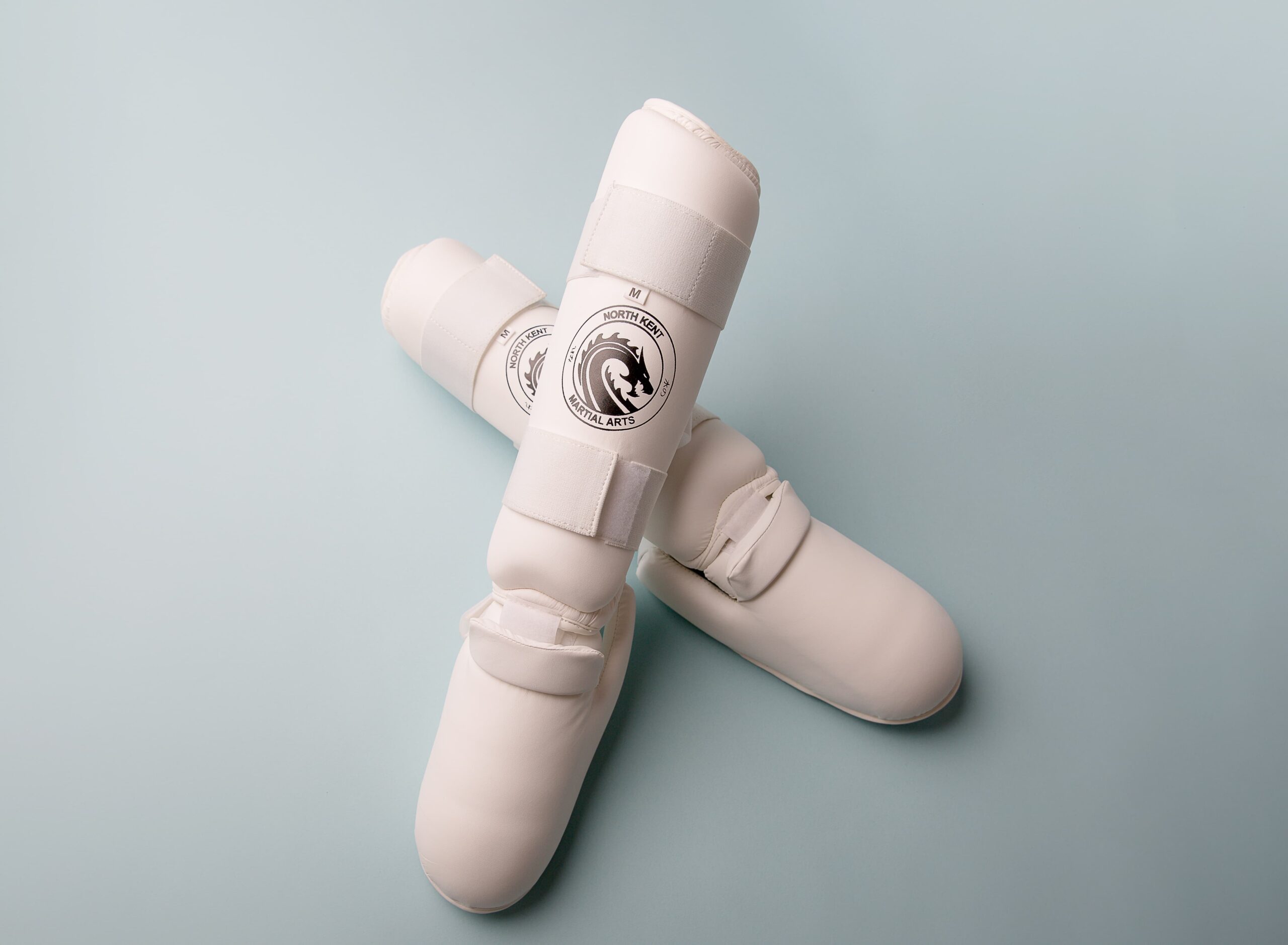 NKMA Leg Protectors product shot, legs crossed