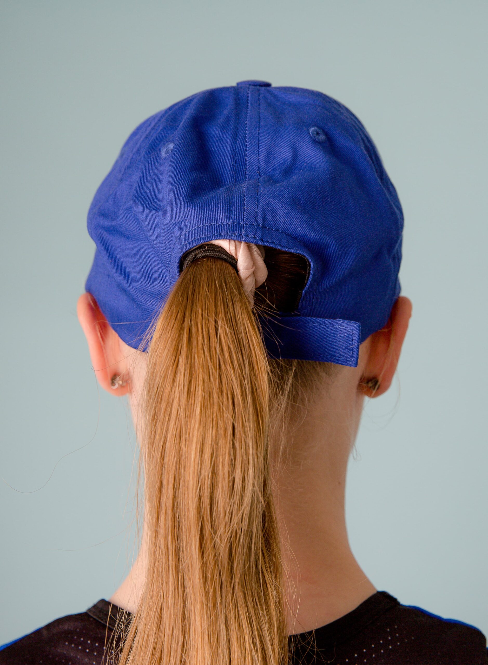 NKMA Blue Baseball Cap - Close up rear on female model