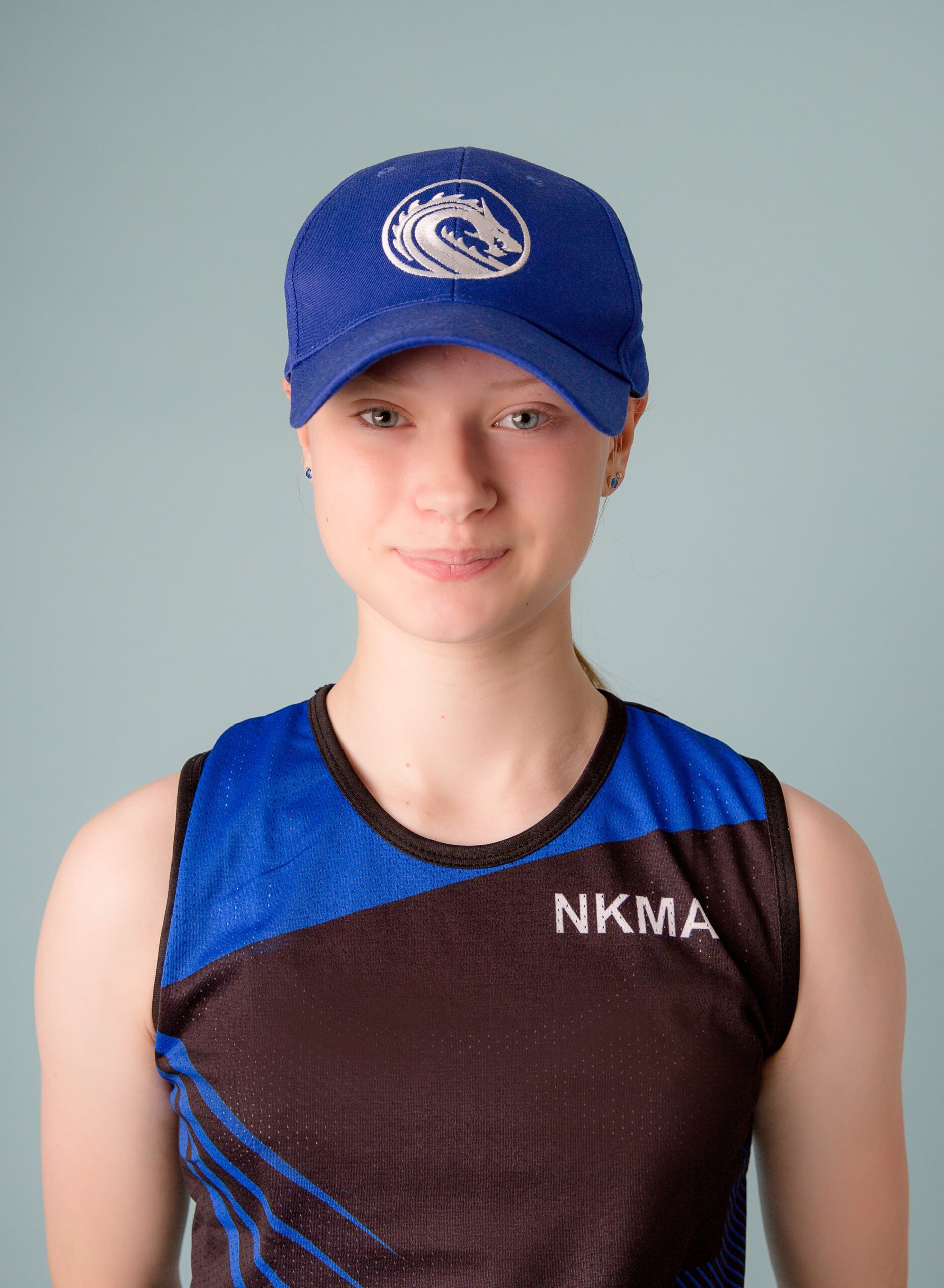NKMA Blue Baseball Cap - Front head shot of female model