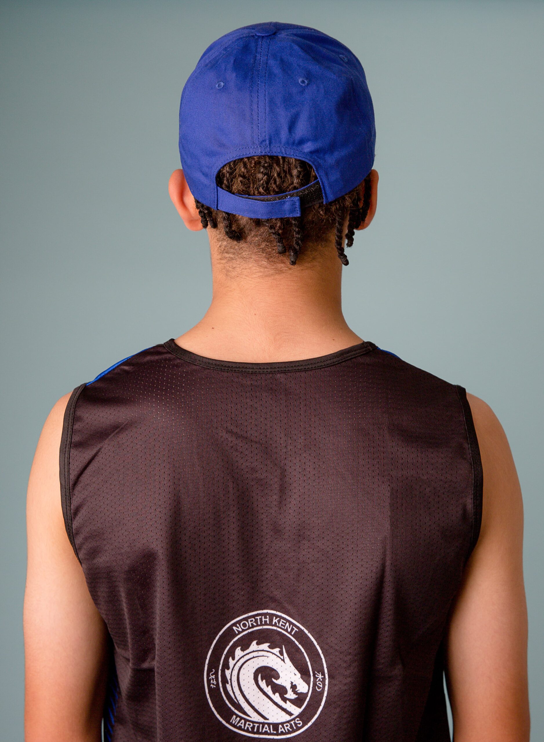 NKMA Blue Baseball Cap - Rear head shot of male model