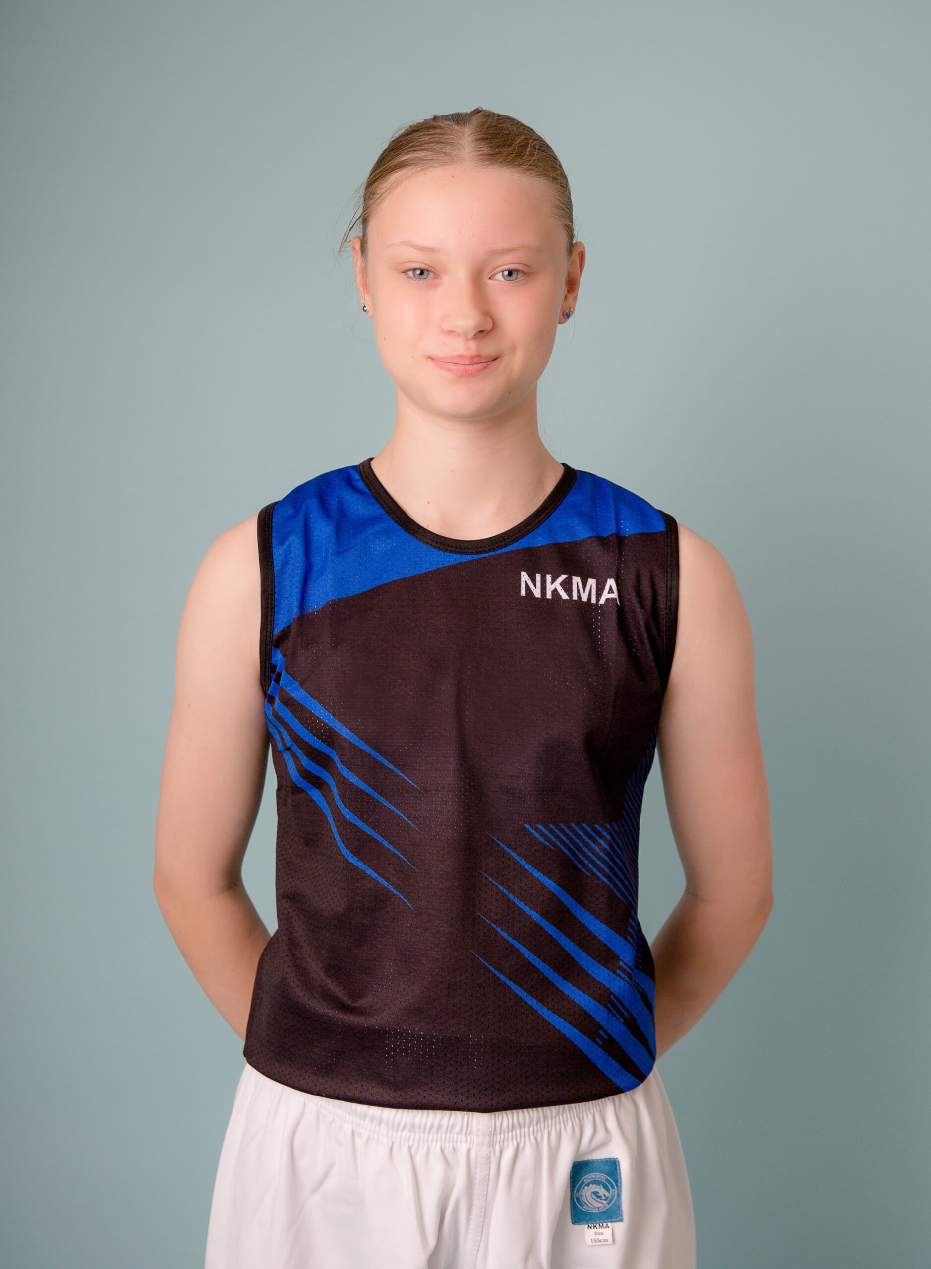 NKMA Ladies Girls Vest - front mid shot of female model