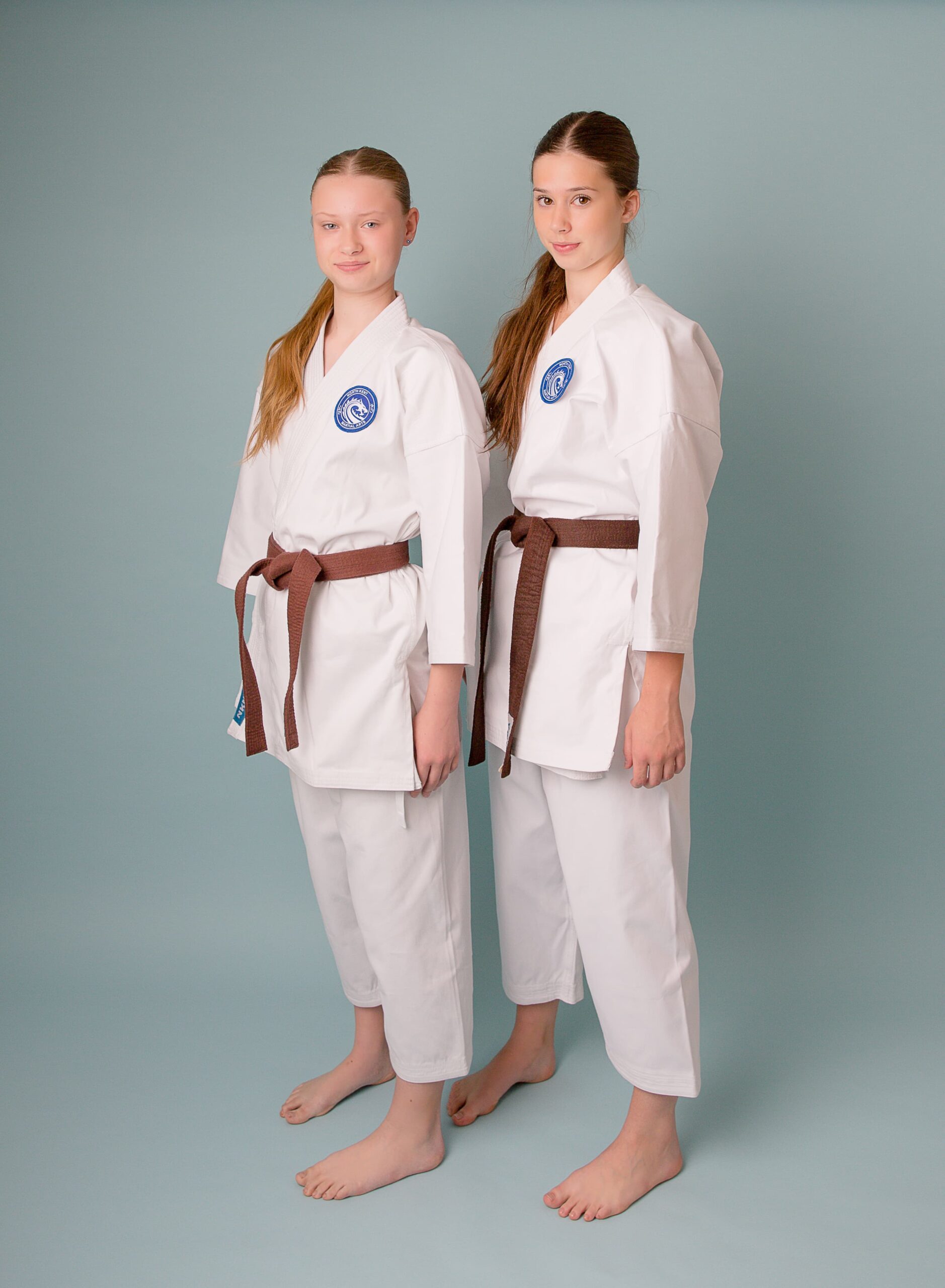 NKMA Premium Heavy Weight Gi - wide shot side profile of two female models